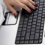 Female Hand on Computer